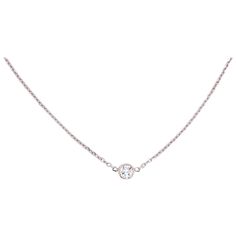 This 14 karat white gold diamond bezel necklace is a classic! This simple design is one to be worn everyday and with any outfit. You can wear it with your finest dress and also in your workout clothes. The diamond is lovely and shines from any angle. If you have seen the traditional Tiffany & Co. Diamond necklace your will realize what a good value you this one is. 18 inch long chain, diamond cut cable chain 0.30 carat diamond I-1 Clarity and G Color-Excellent Quality Diamond Necklace Simple Tiffany, Luxury Dainty White Chain Necklace, Luxury White Dainty Chain Necklace, Luxury Everyday White Gold Necklace, Delicate Luxury White Gold Chain Necklace, Luxury White Necklace With Single Diamond, 1 Carat Necklace Tifannys, Tiffany N Co Necklace, Tiffany Diamond Earrings