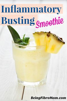 a smoothie in a glass with a slice of pineapple on top and the words, innamatory busting smoothie