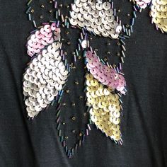 Sequin Shirt Black Top Rayon Gold Pink Silver Floral Sleeves Collar Vintage Boho Glam Women's Small or Medium Size Marked: Women's Medium Best Fit: Women's Small or Medium Details: A great vintage sequin black shirt with only very, very slight distress as shown - see photos for best details. 27in total length 42in total chest 27.5in total sleeve from collar edge to wrist edge Cheap Black Embellished Blouse, Cheap Embellished Tops For Women, Cheap Embellished Black Blouse, Affordable Black T-shirt With Glitter Print, Luxury Embroidered Sequin Top For Women, Cheap Embellished Black T-shirt, Floral Sleeves, Lame Fabric, Black Leather Mini Skirt