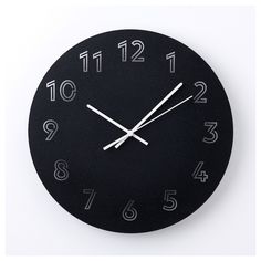 a black clock with white numbers on it