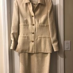 Virgin Wool Cream Jacket And Dress. Classic And Elegant Design. Lining Has Print Of Sheet Music And Floral Scrolls. No Flaws. In Excellent Used Condition. This Suit Has Been Tailored And Fits Usa 4-6. Beige Fitted Designer Sets, Designer Fitted Beige Sets, Beige Designer Sets, Designer Fitted Cream Sets, Elegant Cream Colored Fall Sets, Elegant Cream Sets For Fall, Escada Dress, Cream Suit, Cream Jacket