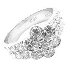 Platinum Diamond Diamond Fleurette Flower Ring by Van Cleef & Arpels. With 19 Round brilliant cut diamonds total weight approximately 1.05ct E/VVS1 Details: Size: European 50.5 US 5.5 Width: 9.5mm Weight: 5.7 grams Stamped Hallmarks: Van Cleef & Arpels PT950 B599XXX(serial number omitted) *Free Shipping within the United States* YOUR PRICE: $8,500 T2967eodd Van Cleef And Arpels Jewelry, Van Cleef & Arpels, Jewellery Business, David Webb, Van Cleef And Arpels, Opening A Boutique, Van Cleef Arpels, Women Diamond, Platinum Ring