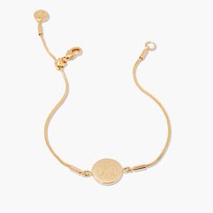 Discover a modern classic with the Wren Bracelet. Handcrafted with a gold snake chain, this unique design is engraved with your personalized initials and adjustable for the perfect fit. An enchanting addition to any look. Are you ready to make a lasting impression? Available in 14k gold plated brass Disc size: 1/2" Adjustable snake chain up to 7" Lobster claw closure With engraving this item is FINAL SALE SKU: BYB1097 Adjustable Tarnish Resistant Name Bracelet, Modern Adjustable Jewelry With Monogram, Modern Personalized Adjustable Jewelry, Classic Adjustable Name Bracelet, Modern Adjustable Engraved Jewelry, Classic Engraved Adjustable Chain Bracelet, Everyday Adjustable Engraved Chain Bracelet, Dainty Adjustable Engraved Chain Bracelet, Classic Adjustable Engraved Chain Bracelet