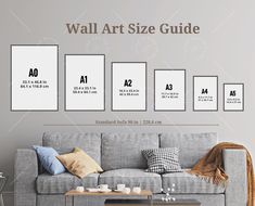 the poster size guide is displayed in front of a gray couch with pillows on it