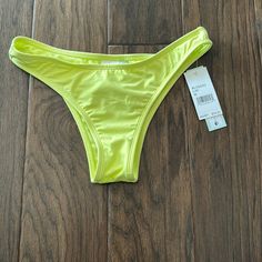 Never Worn Cheeky Style Size M Nwt Yellow Brief Bottoms For Pool, Yellow Pool Brief Bottoms, Stretch Yellow Bottoms For Sunbathing, Yellow Brief Swimwear For Vacation, Yellow Casual Bottoms For Sunbathing, Casual Yellow Bottoms For Sunbathing, Neon Yellow Stretch Swimwear For Spring, Yellow Brief Swimwear For Summer, Yellow Bottoms For Pool In Spring