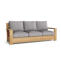 a wooden couch with grey cushions on it's back and arm rests against a white background