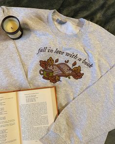 Fall in love with a good book (and a cute crewneck) this season! This crew's design is printed onto an ash gray crew made of 50% cotton and 50% polyester. Crews are preshrunk, so don't worry about shrinkage in the wash! For sizing information, please refer to the size chart provided in the listing. Because each crewneck is handmade by me, the current processing window for orders (not including shipping time) is 4-6 weeks. Please understand that I unfortunately am not able to offer expedited or r Fall Book Decor, Relaxed Fit Bookish Sweatshirt For Fall, Bookish Fall T-shirt With Letter Print, Bookish Crew Neck Sweatshirt As A Gift, Bookish Crewneck, Cheap Crew Neck Bookish Sweatshirt, Bookworm Gifts, Fall Books, Cute Crewneck