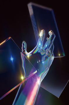 an abstract image of a person holding something in their hand with the light shining through it