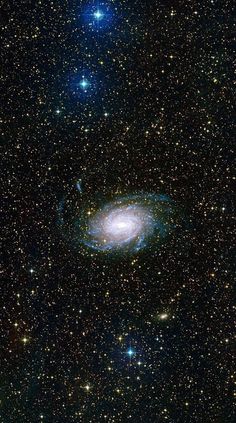 the andromidus spiral galaxy, with stars in the background photo credit nasa / jpc