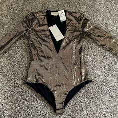 Gucci Size Medium Gold Black Polyamide Blend Metallic Bodysuit Dress Top Gg Tulle Bodysuit Gucci Elegant Evening Bodysuit For Party Season, Elegant Sequined Bodysuit For Night Out, Elegant Long Sleeve Sequin Bodysuit, Chic Sequined Evening Bodysuit, Chic Evening Sequined Bodysuit, Chic Sequined Bodysuit For Evening, Chic Evening Bodysuit With Sequins, Elegant V-neck Bodysuit For Party, Elegant Bodysuit For Night Out And Party Season