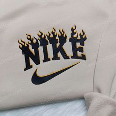 Black Flame Nike Embroidered Sweatshirt, Nike Inspired Embroidered Hoodie, Unique Embroidered Shirt Our clothing store is proud to offer a wide range of high-quality embroidered clothing that combines style and comfort. Among our selection of embroidered garments, our black flame Nike embroidered sweatshirt stands out as a must-have for anyone who wants to make a... Nike Pullover Embroidered, Nike Crewneck Embroidered, Embroidered Nike Crewnecks, Nike Fire Sweatshirt, Nike Embroidered Hoodie, Embroidery Hoodie Nike, One Piece Hoodie, Nike Sweatshirts, Nike Fashion