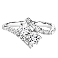 a white gold ring with two diamonds on the side and one diamond in the middle