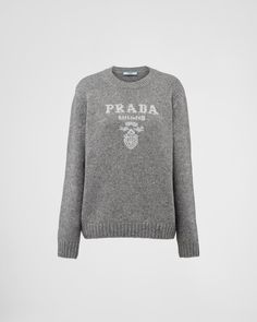 Grey/Silver Wool, cashmere and lamé crew-neck sweater | PRADA Luxury Crew Neck Sweater With Embroidered Logo, Luxury Logo Print Sweater For Fall, Designer Winter Sweater With Logo Detail, Luxury Crew Neck Top With Ribbed Collar, Luxury Winter Sweater With Logo Print, Luxury Crew Neck Sweater With Ribbed Cuffs, Luxury Logo Print Sweater For Winter, Luxury Crew Neck Winter Sweatshirt, Luxury Crew Neck Sweatshirt For Winter