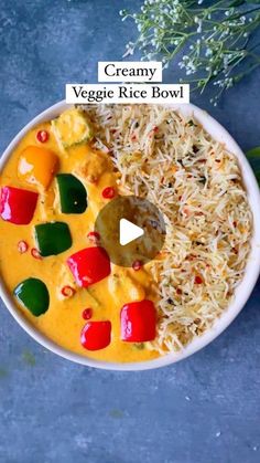 a bowl filled with rice and vegetables on top of a table