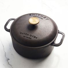 a black pot sitting on top of a white counter