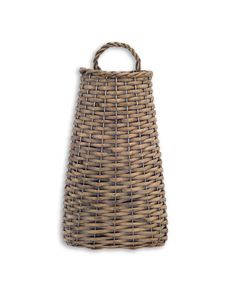 a brown wicker basket with handles on a white background, it has a handle that is attached to the side of the bag