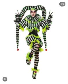 a woman dressed in green and black striped costume