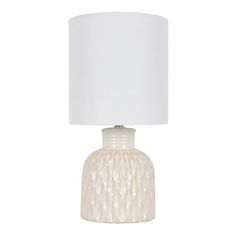 a white table lamp with a white shade