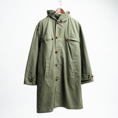 Vintage 60s Dutch Olive Green Parka Jacket - Size Medium Made in the Netherlands this Parka has stayed in amazing condition. Featuring four spacious front pockets, a detachable hood, full metal hardware and a belt.  Size: Medium but please refer to the measurements below to ensure the best fit: Pit to Pit: 27" Back Length from Nape of Neck: 32" Shoulder Seam to Seam - 20"  Arm Length from Shoulder to Cuff: 23" Condition: 10/10 great condition. Please see the photos for more details.  Shipping De Green Parka Jacket, Parka Men, Green Parka, Nape Of Neck, Mens Parka, Full Metal, Parka Jacket, Detachable Hood, Vintage 60s