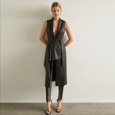 Nwt Bcbgmaxazria Faux Leather Drape Front Long Vest Size Xxs This Structured Long Vest In Supple Faux Leather Features A Classic Notched Lapel, Wide Waist Belt, And Chic Draped-Front Detail. Center Front Button Closure Sold Out / Retails For $368 Attached Adjustable Waist Belt With D-Ring Closure Patch Pockets Dry Clean Elegant Black Outerwear For Going Out, Chic Fitted Outerwear For Going Out, Elegant Fitted Outerwear For Going Out, Long Vest Outfits For Women, Long Vest Outfit, Vest Outfits For Women, Animal Print Vests, Wide Waist Belt, Tan Vest