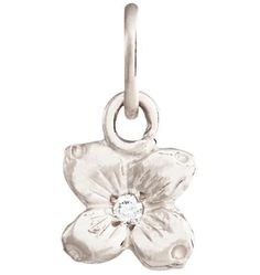 a flower charm with a diamond in the center