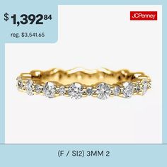 an image of a gold ring with diamonds on it and the price is $ 1, 392