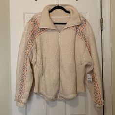 White Fleece Sherpa Jacket With Pink And Blue Embroidery From Free People (Fp Movement Line). New With Tags! Never Worn. Size L, Relaxed Comfy Fit. Zippered Pockets, Sooo Soft And Smooth Inside, Outside Sherpa Is Super Soft Too, Ribbed Collar. Cozy White Fleece Jacket For Fall, Cream Fleece Jacket With Fleece Lining, White Fleece Outerwear With Fleece Lining, Cozy Cream Sherpa Fleece Jacket, Cream Sherpa Fleece Jacket For Fall, Cream Fleece Outerwear With Fleece Lining, White Sherpa Fleece Jacket With Fleece Lining, White Sherpa Fleece Jacket For Winter, Cream Fleece Outerwear For Cold Weather