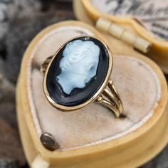 This pretty cameo ring is centered with a bezel set sard onyx cameo. The ring is crafted in 14k yellow gold and is currently a size 4.75. There is a hairline fracture in the cameo that has been expertly repaired. Cameo Rings For Sale, Luxury Vintage Cameo Ring, Hairline Fracture, Antique Cocktail Ring, Cameo Ring, Cocktail Rings, Bezel Setting, Vintage Rings, Onyx