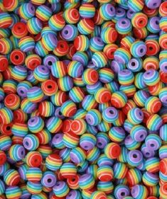 multicolored beads are stacked up together