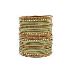 Elevate your upcoming wedding celebrations with our ready-to-wear Mehndi Shimmer Bangle Set. Designed to wear on both hands, this set seamlessly mixes shimmery plain bangles with antique gold accents, perfect styled with your best Indian attire. ABOUT THIS PRODUCT  26 bangles in total antique gold finish bead and champagne crystal bangles shimmer plain bangles sizes available Traditional Green Beaded Bracelets For Wedding, Green Beaded Bangle Bracelets For Wedding, Bohemian Bangle For Festive Celebration, Elegant Adjustable Bangle For Diwali, Festive Bohemian Bangle For Celebration, Green Bohemian Bracelet For Festive Occasions, Adjustable Green Bangle For Celebration, Traditional Festive Stackable Bracelets, Festive Traditional Stackable Bracelets