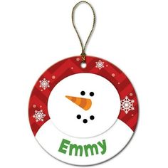 a snowman ornament hanging from a string