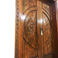 an intricately carved wooden door is shown