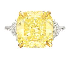 An exquisite 10 carat fancy yellow diamond ring set in platinum and 18 carats yellow gold the ring has been handmade in Italy with two side tapered baguettes also 100% eye clean and full of brilliance! Canary Yellow Diamond Engagement Ring, 10 Carat Diamond Ring, Canary Diamond Ring, Yellow Diamond Jewelry, Fancy Yellow Diamond Ring, Yellow Diamond Ring, Canary Diamond, Cushion Cut Diamond Ring, Diamond Ring Set