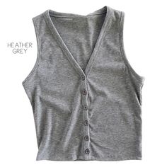 This will be a favorite go-to tank for your closet. A very versatile piece that can be worn over jeans or leggings or layered with your favorite cardigan. 95% Polyester 5% Spandex Ribbed Tank Top For Fall Day Out, Button Front Tank Top, Stretch Tops With Buttons For Layering, Versatile Tops With Button Closure For Layering, Fall Ribbed Tank Top For Day Out, Gray Stretch Tank Top For Fall, Stretch Tops With Button Closure For Loungewear, Solid Tops With Buttons For Layering, Casual Stretch Tank Top With Button Closure