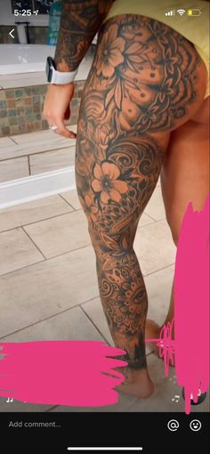 a person with tattoos on their legs and leggings