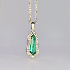 "This is a kite shaped emerald pendant necklace 14K solid gold. The unique long emerald necklace is the May Birthstone gemstone. This dainty layering necklace makes a great Holiday, Christmas, mothers day, birthday or bridal party gift. To revisit our shop click here: https://etsy.me/3Pzzwpx For more emerald necklace options click here: https://etsy.me/3Td2gnv For emerald earrings click here: https://etsy.me/3AN4nqW The pendant pictured is a lab created emerald #8283 Available with lab created r Emerald Pendant Necklace, Dainty Necklace Layered, Emerald Necklace Pendant, Emerald Blue, Lab Created Emerald, Jewelry Dainty, Emerald Pendant, Ruby Necklace, May Birthstone