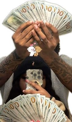 a man holding his head with money in front of him and covering his face with both hands