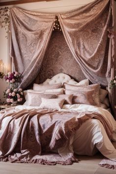 a large bed covered in lots of pink and white pillows next to a window with curtains