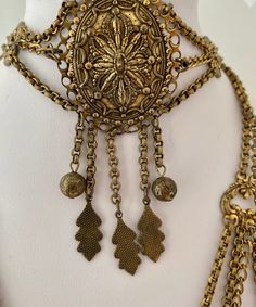 "Etruscan Revival Festoon Necklace and Bracelet Set Gold Tone Ornate Vintage Patina Necklace - 16.5\" plus festoon drop with dangles additional 4\" Length Bracelet - 7.5\" Bracelet medallion 1.76x x 1.50@ No markings Aged patina, can use white vinegar to brighten if preferred" Ornate Adjustable Jewelry For Festive Occasions, Bohemian Antique Gold Jewelry For Festival, Antique Bracelet Jewelry For Festivals, Festive Bohemian Jewelry With Adjustable Chain, Festival Antique Gold Jewelry With Intricate Design, Vintage Metal Jewelry For Festive Occasions, Elegant Antique Finish Jewelry For Festivals, Bohemian Bronze Jewelry For Wedding, Elegant Antique Gold Jewelry For Festivals