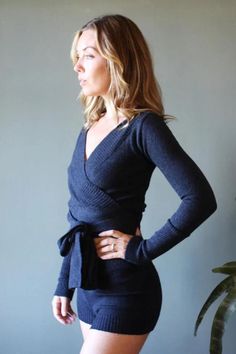 Wrap yourself in warmth with this elegant ballerina shrug, crafted from soft Merino wool. Featuring long double knit ties, an off-the-shoulder ribbed neckline, and fitted sleeves (24"), this cropped style is perfect for layering over a sleeveless dress or camisole on chilly nights. The fixed body length is 16", shown on a 5'9" model with measurements 36"/30"/39" in size Small. Handmade in the USA and made to order in 1-2 weeks. Hand wash only and lay flat to dry. Fall Wrap Top With Tie Waist, Chic Fall Wrap Top For Brunch, Fitted Wrap Top For Winter, Fitted Fall Wrap Top With Tie Waist, Fall Season Wrap Top For Brunch, Fall Wrap Top For Brunch, Fitted Wrap Top With Tie Waist For Fall, Long Sleeve Wrap Top For Fall Brunch, Versatile Fitted Wrap Top With Tie Waist