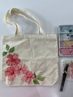 Hand painted with watercolors and sealed with a clear enamel spray. The canvas tote bag measures 15.7"W x 14.9"H, with an inner pocket size of 7.8"W x 7.8"H. Both the main body and inner pocket of the tote bag feature high-quality zippers, providing added storage and security. Cheap Hand Painted Shoulder Bag For Everyday Use, Cheap Hand Painted Canvas Bag For Daily Use, Flower Painting Tote Bag, Tot Bag Painting, Paint On Canvas Bag, Diy Bag Design Ideas, Painting Ideas Tote Bag, Toat Bag Painting Ideas, Bag Painting Design