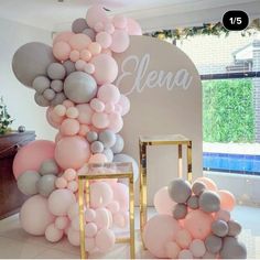 the balloons are all over the room and there is a sign that says eleva on it