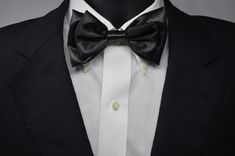 Our rendition of the classic black bow tie. Handcrafted Satin 5 x 2.75 inches with adjustable neck band of  twenty inches. Can be worn, anywhere, anytime, any place, you decide. Classic Adjustable Bow For Business, Adjustable Classic Bow For Business, Classic Solid Bow For Black-tie Events, Classic Black Tuxedo For Party, Classic Black Party Tuxedo, Elegant Solid Color Business Bow Tie, Elegant Adjustable Bow Tie For Black-tie Events, Adjustable Classic Bow Tie For Party, Classic Black Ribbon Bow For Evening