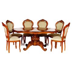 an antique dining table and chairs with white upholstered backrests, set against a white background