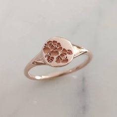 Rose signet ring, elegant and unique 14k gold signet ring, Vintage style floral ring. * Band width: 1.4 mm, round signet part width: 8 mm * Thickness: 1.4 mm * Available in 14K or 18K YELLOW, WHITE and ROSE gold. The price listed is for 14K please contact me for 18K pricing. * available with darkend flower ( please mention in note to seller) * Sizes vary from 5 US to 9 US, including half sizes. Please choose your size upon checkout. * Please choose a finish: Shiny or Matte, and mention in note t Unique Gold Wedding Rings, Signet Ring Vintage, 14k Gold Signet Ring, Flower Wedding Band, Floral Wedding Bands, 14k Gold Wedding Band, Ring Elegant, Fine Gold Jewelry, Ring Flower