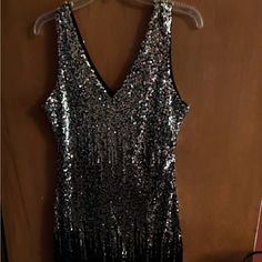 This Silver And Black Party Dress Is Fun, New With Tags, Fits A 10/ 12 Best Silver Sleeveless Sequin Party Dress, Silver V-neck Sequin Party Dress, Silver Sleeveless Sequin Dress For Evening, Silver Sleeveless Sequin Evening Dress, Sleeveless Silver Sequin Evening Dress, Silver Sleeveless Sequin Dress For Holiday Party, Silver Sequin Dress For Party Season, Sleeveless Silver Sequin Dress For Party Season, Silver Sleeveless Sequin Dress For Night Out