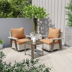 two chairs and a table sitting on top of a cement floor next to a tree