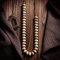 Embark on a journey of mindfulness with 36-Bead Bodhi Seed Mala, a symbolic circle of serenity inspired by Tibetan Buddhist traditions. Each Bodhi seed bead represents a step towards enlightenment, while the meticulously knotted Tibetan Agate on a durable rope adds both strength and spiritual depth to this meditation accessory. · Beads Material: Bodhi seed (Daemonorops Margaritae seed)· Main Bead: Tibetan Agate· Accessories: Silver Letters· Process: Handmade (Up to five days)· Package: Eco envel Traditional Natural Beads As A Gift, Traditional Natural Beads For Gifts, Bohemian Beaded Necklaces With Round Beads For Puja, Bohemian Wooden Beads Jewelry For Puja, Bohemian Necklaces With Wooden Beads For Puja, Traditional Natural Jewelry For Rituals, Traditional Natural Necklace For Meditation, Bohemian Round Beads For Meditation, Bohemian Wooden Beads For Puja