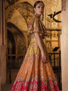 Luxury Mehndi Lehnga Choli for Wedding with Magnificent Look emblazoned with beautiful embroidery, dabka and sequins. This lehnga is unique in style and have classy look and perfect choice for traditional bride. Choli:Short Choli for bridal lehnga is yellow color is embellished with fully copper color embroidery, dabka, nakshi, stones, cutdana, crystals work. Neckline is decor with embroidery and with half sleeves. Fabric used for shirt is chiffon. Lehnga: Stylish Lehnga in three colosr is embel Mehndi Lehnga, Choli For Wedding, Mehndi Dresses, Raw Silk Lehenga, Pakistani Bridal Dresses, Indian Bridal Outfits, Wedding Dresses For Girls, Pakistani Bridal, Designer Dresses Indian