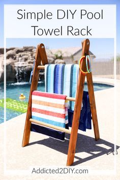 a towel rack with towels hanging on it and the words, simple diy pool towel rack